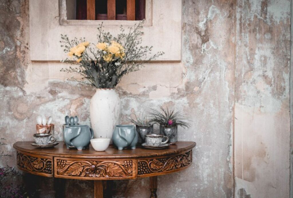 Vintage or antique vases and decoration on wooden table